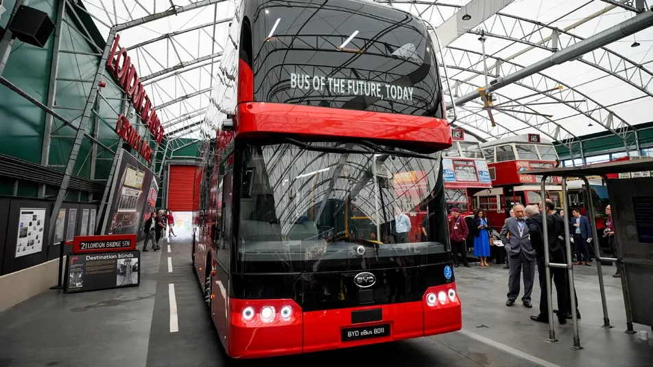 Front view of the BYD BD11 bus inside the venue.